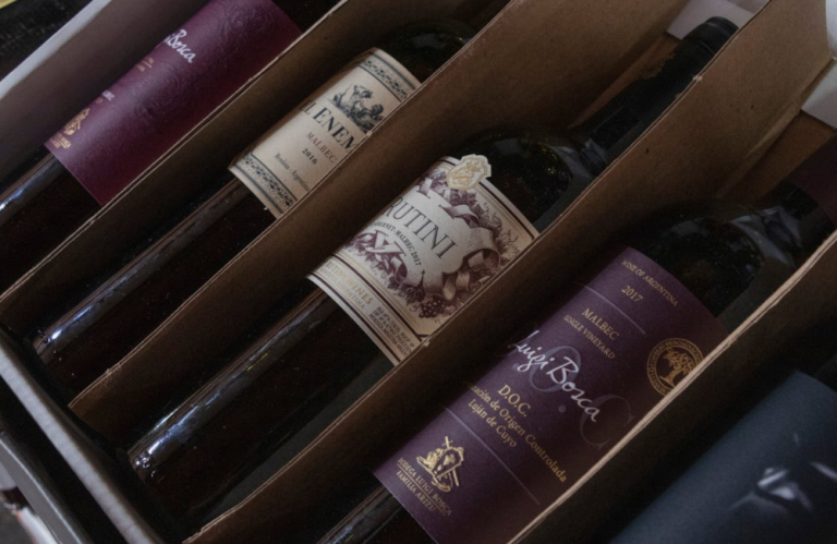 Wine bottles separated by carboard.