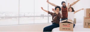 Happy family celebrating with Ready Movers on moving day Brisbane